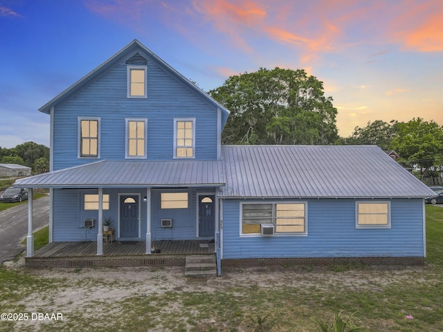 161 W 2nd Ave, Pierson, FL 32180 - view of front of property featuring covered porch, a metal roof, and cooling unit