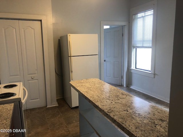 161 W 2nd Ave, Pierson, FL 32180 - kitchen with freestanding refrigerator, range, and light countertops