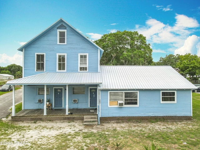 161 W 2nd Ave, Pierson, FL 32180 - view of front of property featuring a porch, a metal roof, and cooling unit