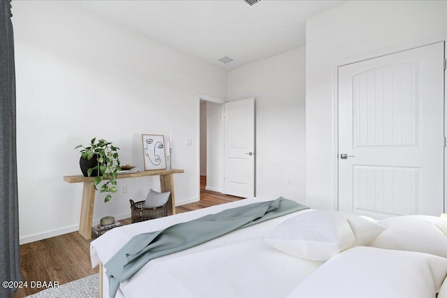 bedroom featuring dark hardwood / wood-style flooring