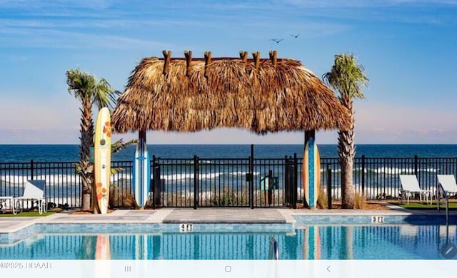 580 Barefoot Life Ln, Daytona Beach, FL 32124 - view of swimming pool featuring a water view, fence, and a gazebo