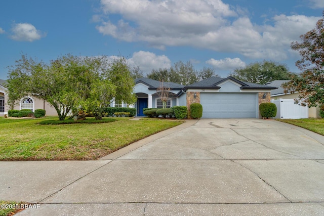 ranch-style home with a garage and a front yard