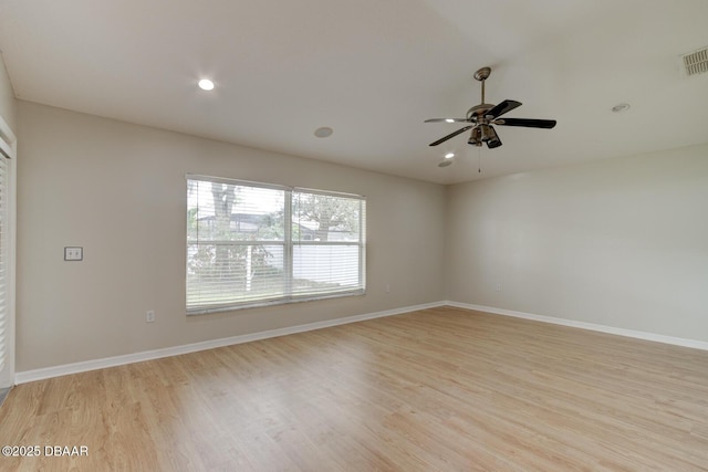 spare room featuring ceiling fan and light wood-type flooring