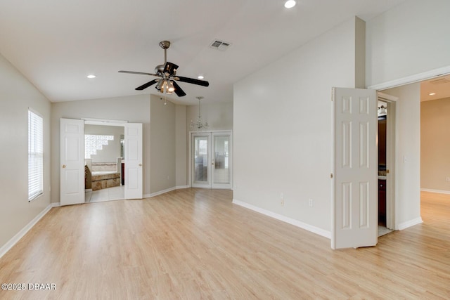 unfurnished living room featuring ceiling fan, light hardwood / wood-style flooring, and lofted ceiling