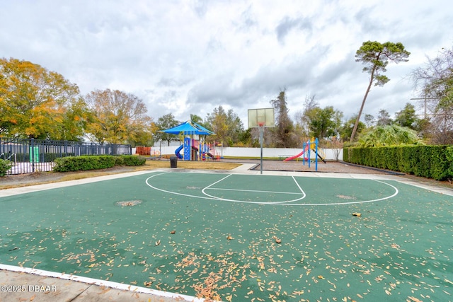 view of sport court with a playground