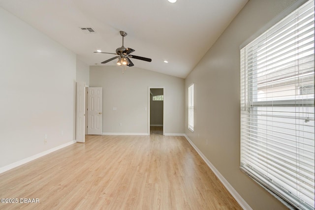 unfurnished room with vaulted ceiling, ceiling fan, and light hardwood / wood-style flooring