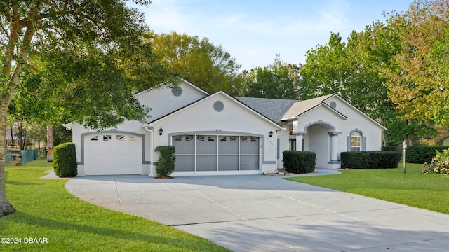 ranch-style house with a garage and a front yard