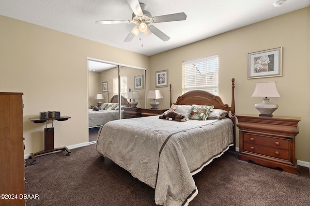 bedroom featuring ceiling fan, a closet, and dark carpet