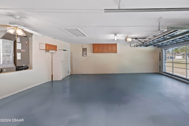 garage with a garage door opener and ceiling fan