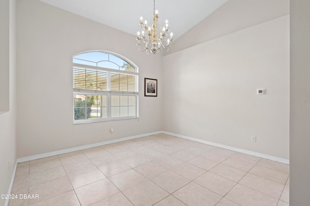 empty room with an inviting chandelier, vaulted ceiling, and light tile patterned floors