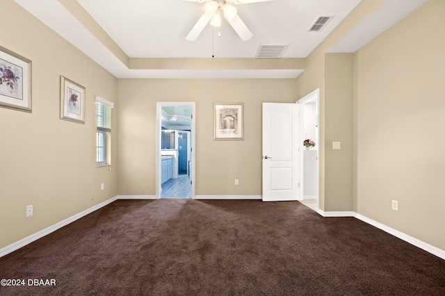 spare room featuring ceiling fan and carpet floors