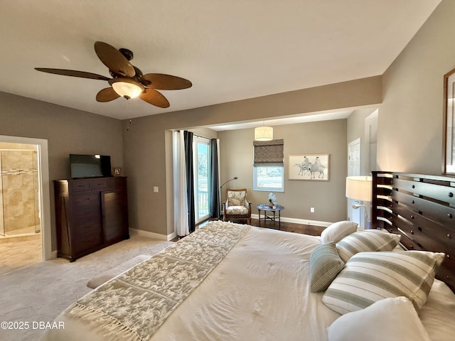 2948 N Ocean Shore Blvd, Flagler Beach, FL 32136 - bedroom featuring baseboards, a ceiling fan, and ensuite bath