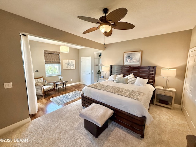 2948 N Ocean Shore Blvd, Flagler Beach, FL 32136 - bedroom with baseboards, ceiling fan, wood finished floors, and a closet