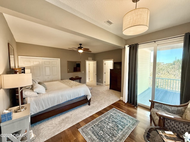 2948 N Ocean Shore Blvd, Flagler Beach, FL 32136 - bedroom with visible vents, wood finished floors, a closet, and access to exterior