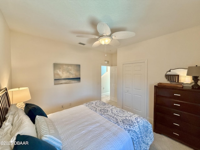 2948 N Ocean Shore Blvd, Flagler Beach, FL 32136 - bedroom with visible vents, a closet, ceiling fan, and light colored carpet