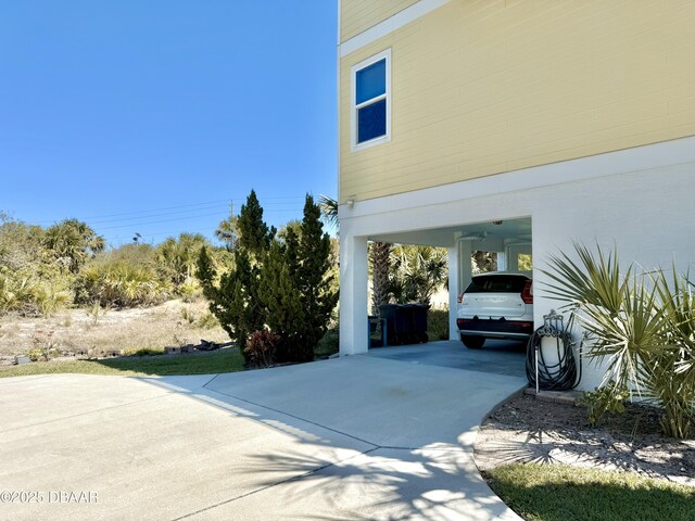 2948 N Ocean Shore Blvd, Flagler Beach, FL 32136 - view of property exterior featuring a carport and driveway