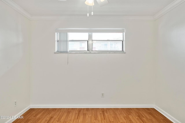 empty room with wood-type flooring, ceiling fan, and ornamental molding