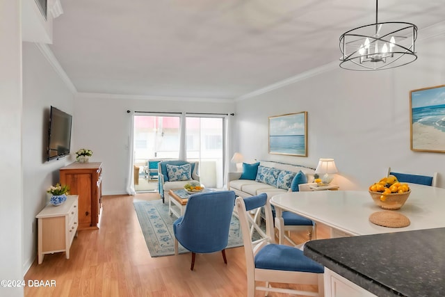 living room featuring crown molding, light hardwood / wood-style flooring, and a chandelier