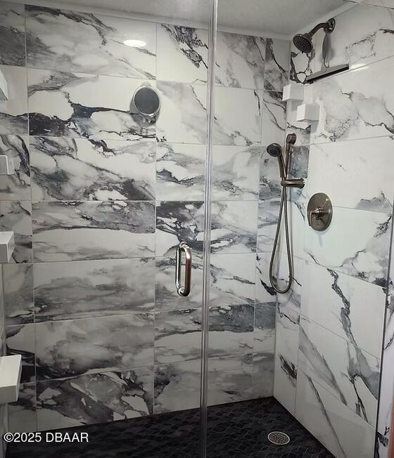 3807 S Atlantic Ave Unit 203, Daytona Beach, FL 32118 - bathroom featuring a stall shower