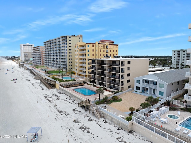 3807 S Atlantic Ave Unit 203, Daytona Beach, FL 32118 - aerial view of a pool area, nearby beach, and apartment complex