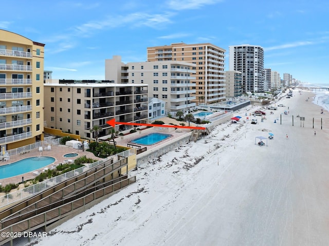 3807 S Atlantic Ave Unit 203, Daytona Beach, FL 32118 - view of property with a community pool and a view of city