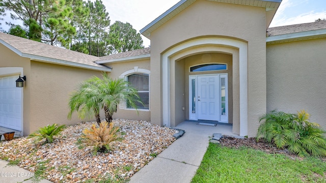 doorway to property featuring a garage