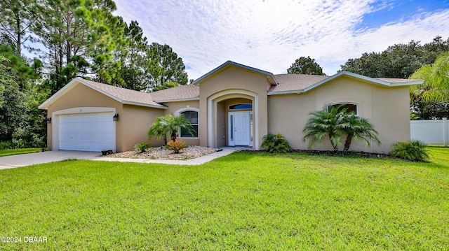 ranch-style home featuring a garage and a front lawn