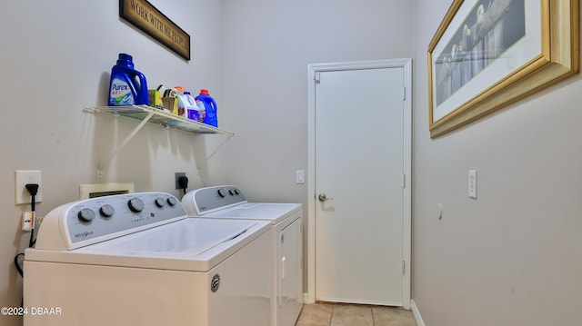 laundry room featuring light tile patterned flooring and independent washer and dryer