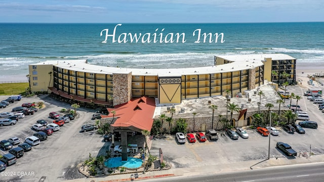 aerial view featuring a view of the beach and a water view