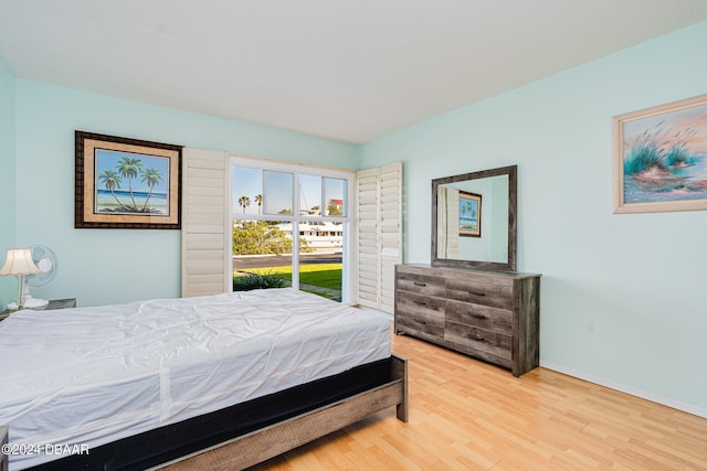 bedroom with hardwood / wood-style flooring