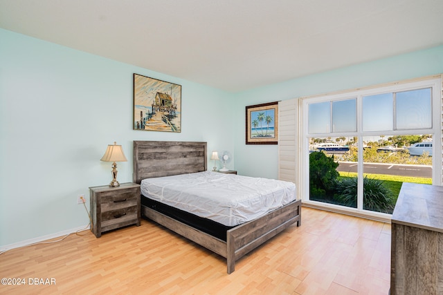 bedroom with hardwood / wood-style floors