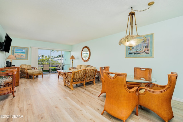 dining room with light wood-type flooring