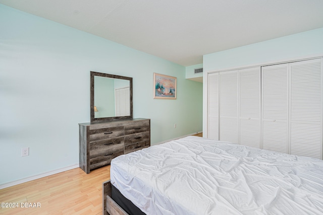 bedroom featuring a closet and hardwood / wood-style floors