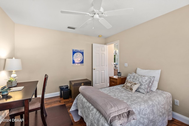 bedroom with ceiling fan and dark hardwood / wood-style floors