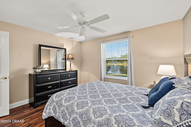 bedroom featuring ceiling fan and dark wood-type flooring