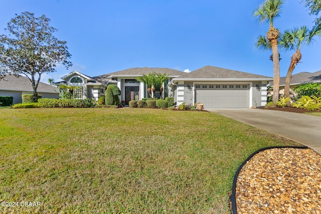 ranch-style home featuring a garage and a front lawn