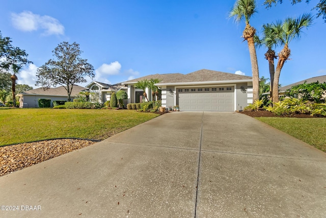 view of front of property featuring a garage and a front yard