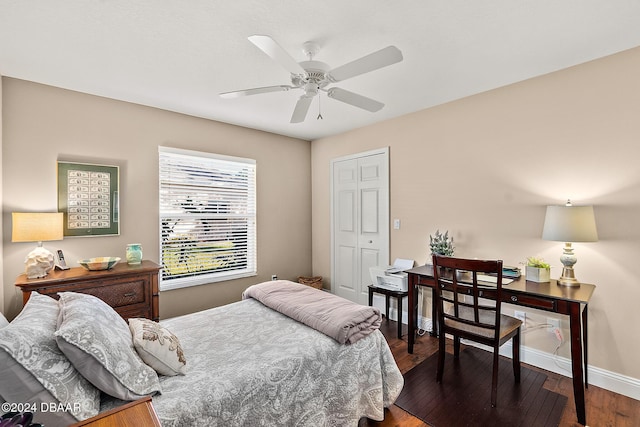 bedroom featuring a closet, ceiling fan, and dark hardwood / wood-style floors