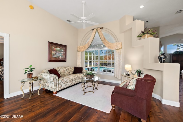 living room featuring dark hardwood / wood-style flooring and ceiling fan