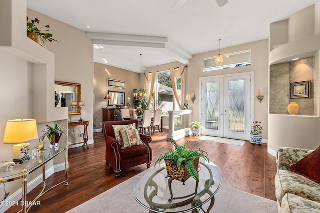 living room featuring ceiling fan, dark hardwood / wood-style flooring, beamed ceiling, and french doors