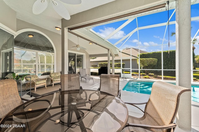 exterior space featuring ceiling fan and a pool