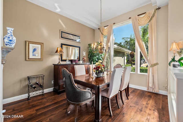 dining room featuring a chandelier and dark hardwood / wood-style floors