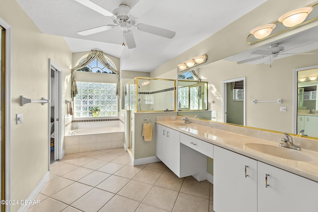 bathroom with ceiling fan, tile patterned flooring, separate shower and tub, vaulted ceiling, and vanity