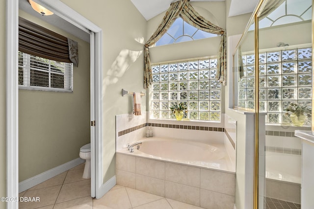 bathroom featuring tile patterned floors, separate shower and tub, and toilet