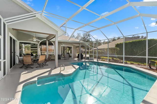 view of pool featuring a lanai, a patio area, and ceiling fan