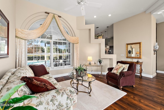 living room featuring ceiling fan, dark hardwood / wood-style flooring, and high vaulted ceiling