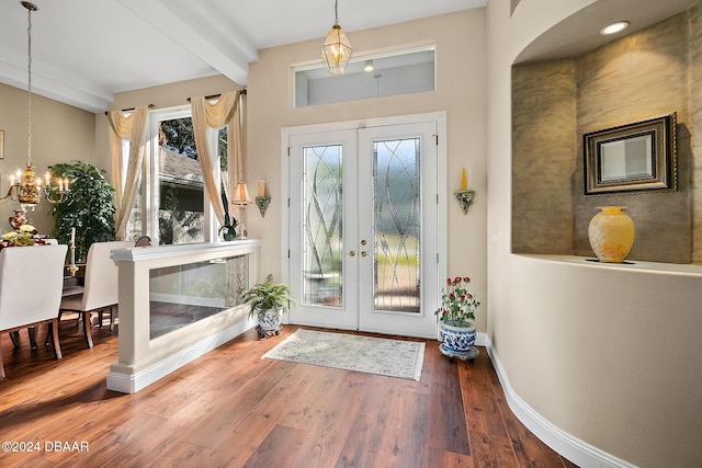 entrance foyer with french doors, beamed ceiling, and wood-type flooring