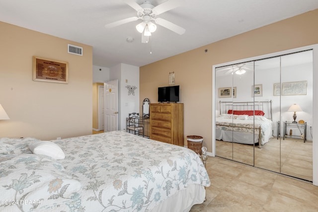 bedroom with ceiling fan and a closet