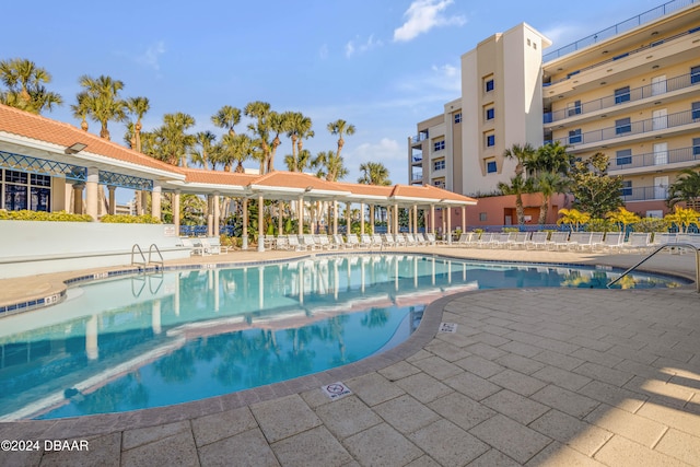 view of swimming pool featuring a patio