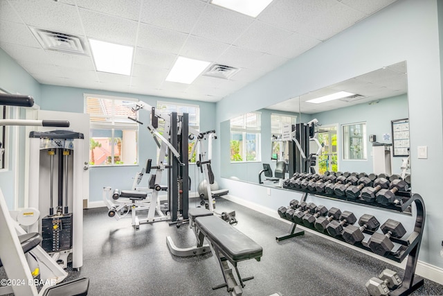 workout area with a paneled ceiling